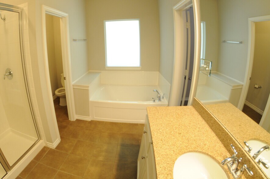 Master bath with garden tub, separate shower, granite and separate water closet - 3426 W 4th St