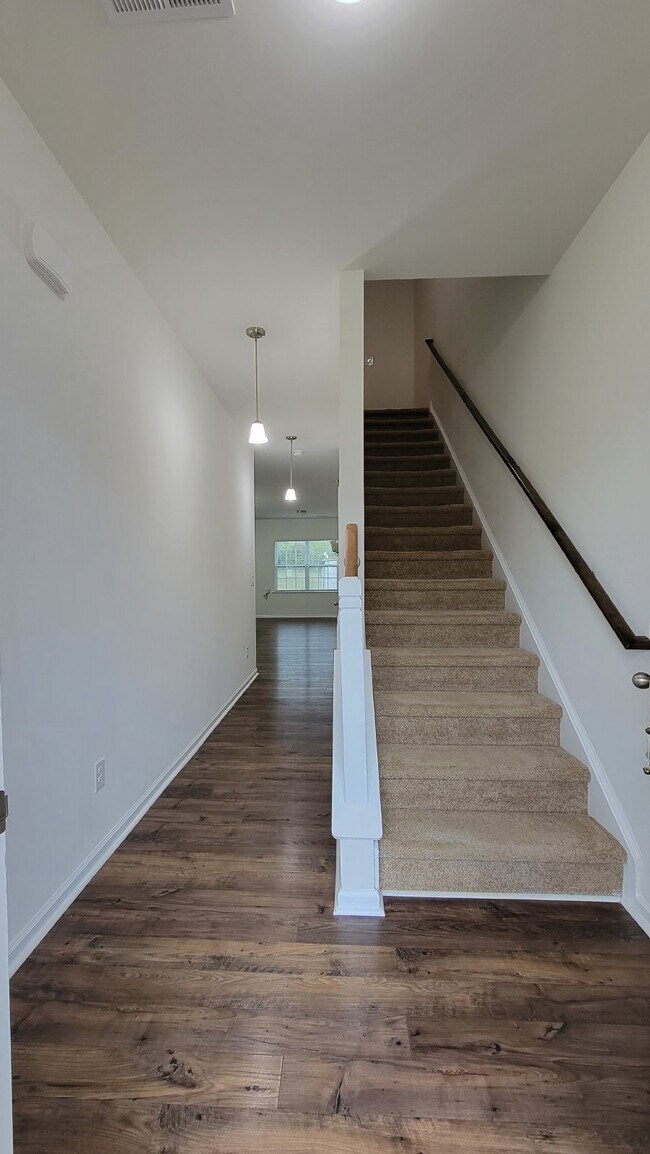Building Photo - "Modern 3-Bedroom Multiplex with 3 Full Ba...