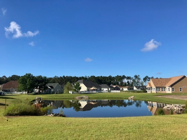 Building Photo - POND FRONT 4 Bedroom home in Jackson Estates - St. James Schools w/ 2 car garage!
