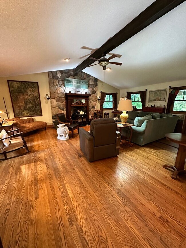 Building Photo - Dream Home in Highland, Michigan: Your Private Oasis on 5 Wooded Acres