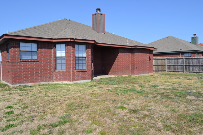 Building Photo - All brick beauty with fireplace and fenced...