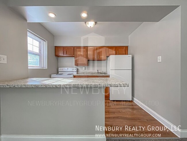 Building Photo - Modern One-Bedroom Apartment in Port Vue: ...