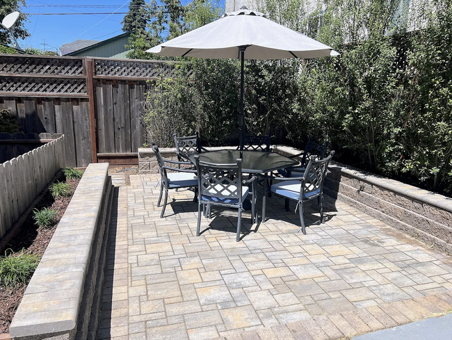 New patio with stonework and raised beds - 2108 E 23rd St