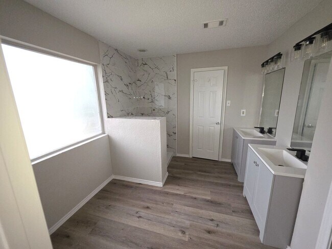Building Photo - Spacious 4-Bedroom Home with Pool & Spa in...