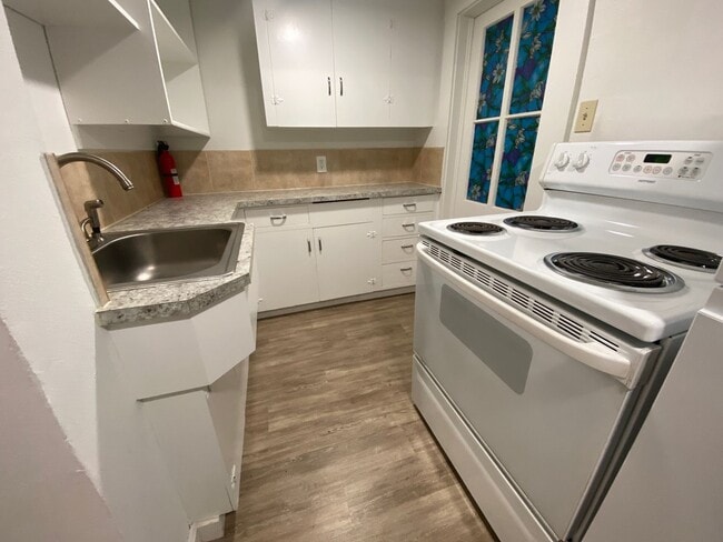 Building Photo - Charming Studio with Shared Patio and Coin-Op Laundry