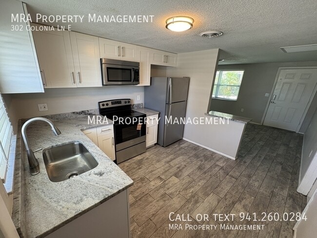 Building Photo - 302 Colonia Ln E