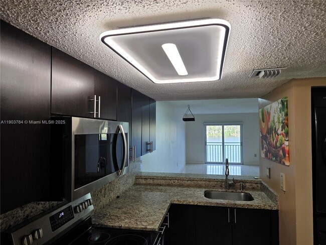 Building Photo - 9917 W Okeechobee Rd