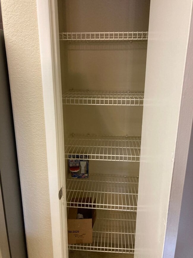 Building Photo - Gated community just minutes south of the strip, 2br/2bath, 2nd floor condo.