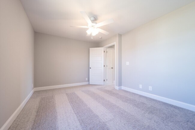 Building Photo - Elegant Home with Stone Fireplace, Kitchen Island and Designer Primary Suite