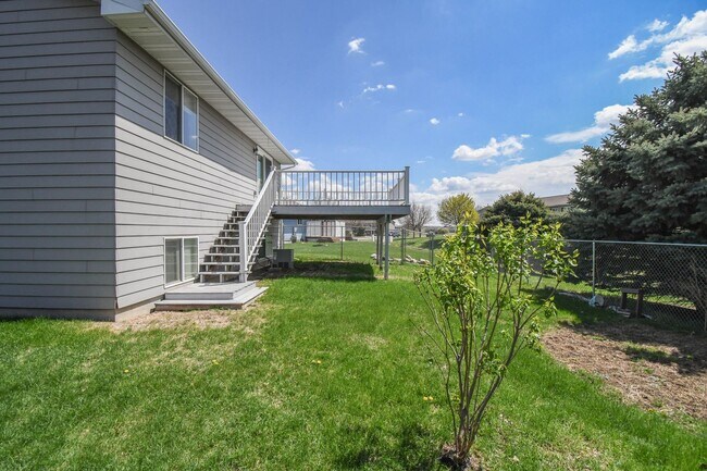 Building Photo - Updated 3BR Split-Level Home with Huge Deck, Fenced Yard & 2-Car Garage Near I-29!