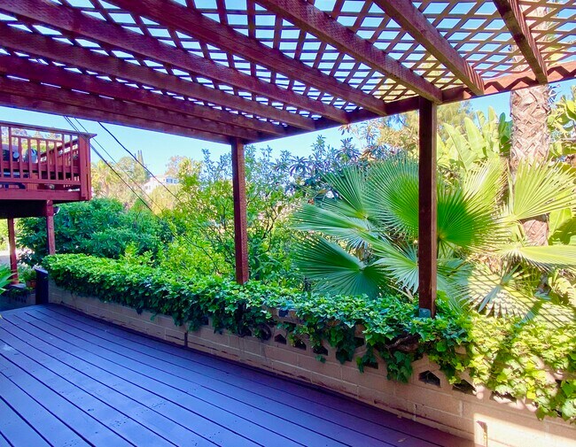 Shaded private deck shown unfurnished.oundings - 1672 Rotary Dr