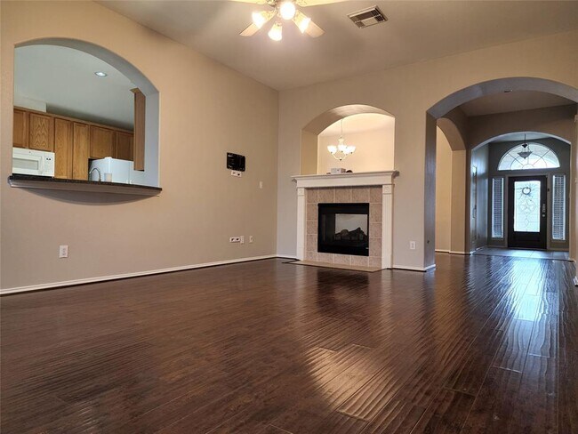 Double sided fireplace between formal dining room and living room - 4826 Claymill Ct