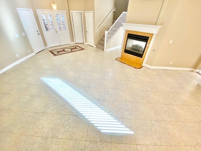 Building Photo - THIS SPACIOUS RESIDENCE FEATURES 4 BEDROOM...