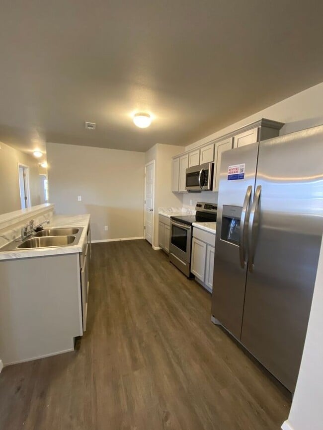 Building Photo - Don't Miss Out! Beautiful 3-Bedroom Duplex with Two-Car Garage & Lawn Care Included