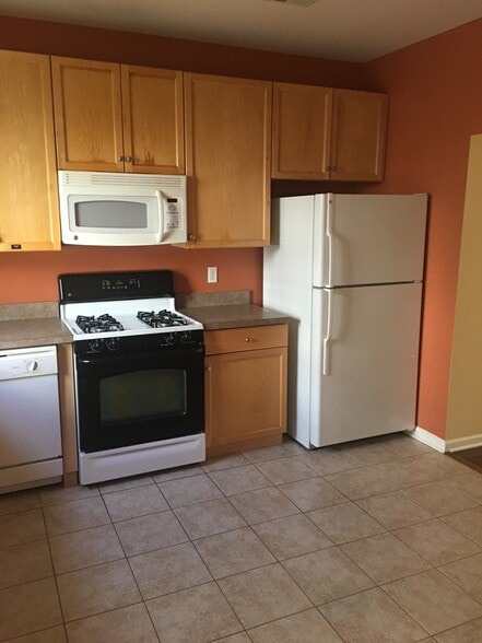 Kitchen including fridge, gas cooktop, dishwasher and microwave - 201 Dey St