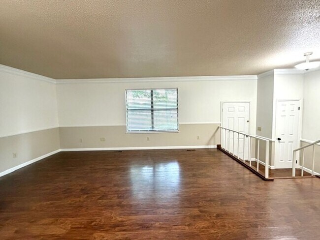 Building Photo - 2 Bedroom 1 Bath Duplex with garage/basement, side porch, and carport.