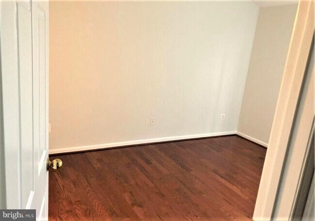 Building Photo - Welcome to this beautifully appointed two level upper condominium that combines modern style with...