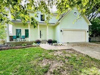Building Photo - Blue Valley Schools w/ Wood Floors, Finished Basement and a Peaceful, Private Fenced Yard!
