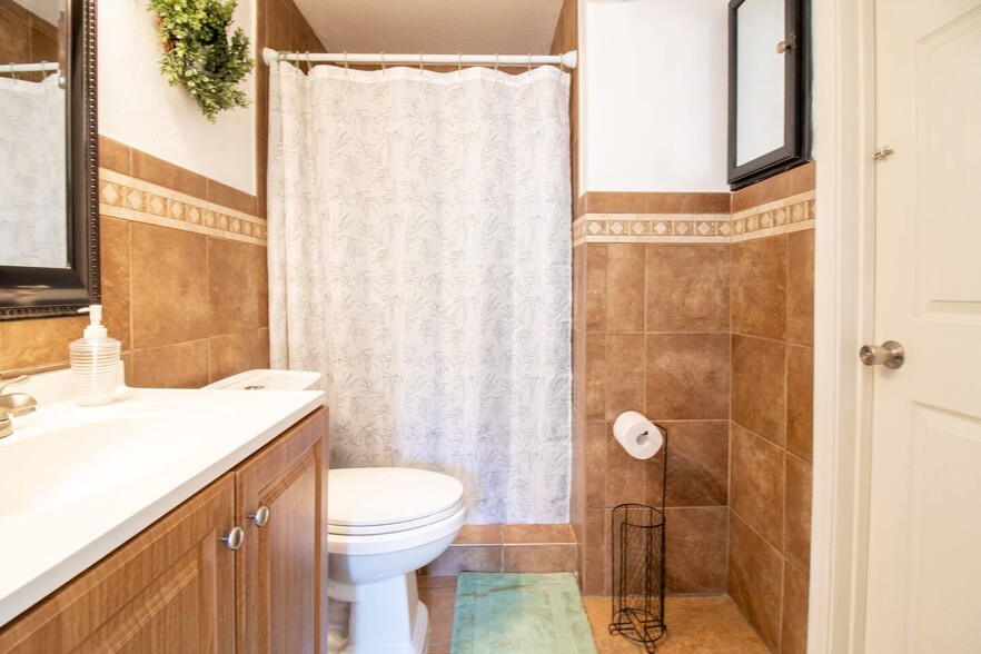 A full private bathroom. - 5901 W Cypress St