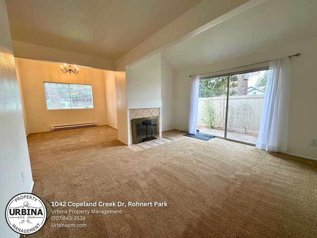 Building Photo - Charming 2-Bed, 1.5-Bath End-Unit Condo in...