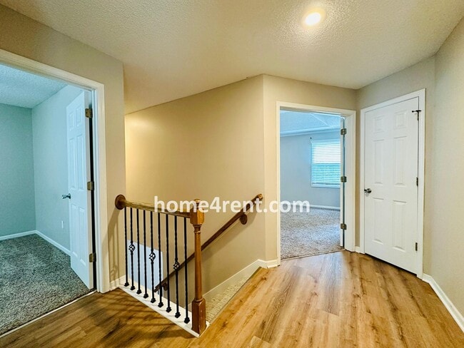 Building Photo - Updated Kitchen, Large Two Tiered Deck, Finished Basement in Blue Valley Schools!