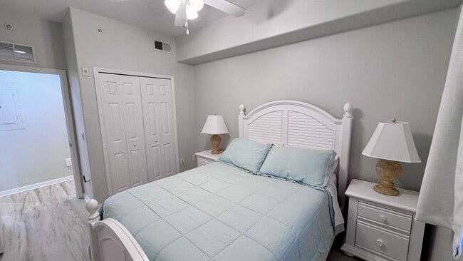 Building Photo - Elevated Luxury at The Terraces – 4th Floor Lake & Golf Course Views! 55+ Community!