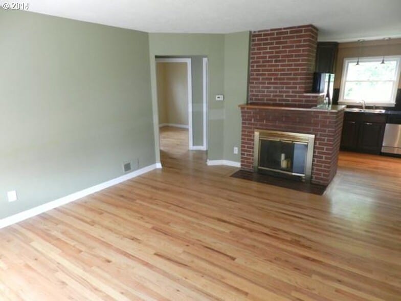 Walls and fireplace have been painted since photo. New doors have been installed on fireplace since photo. - 9003 SE Stephens St
