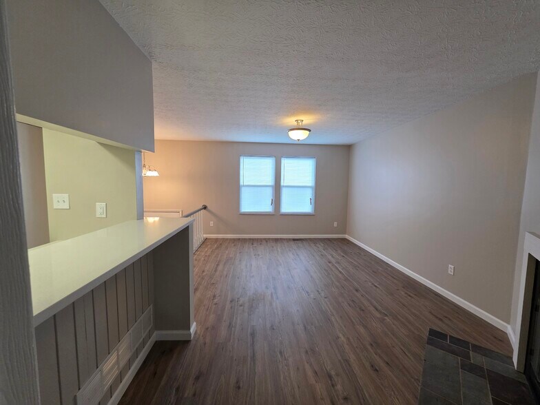 Living Room & Bar passthrough to Kitchen (Upper Level) - 3000 Essington Dr