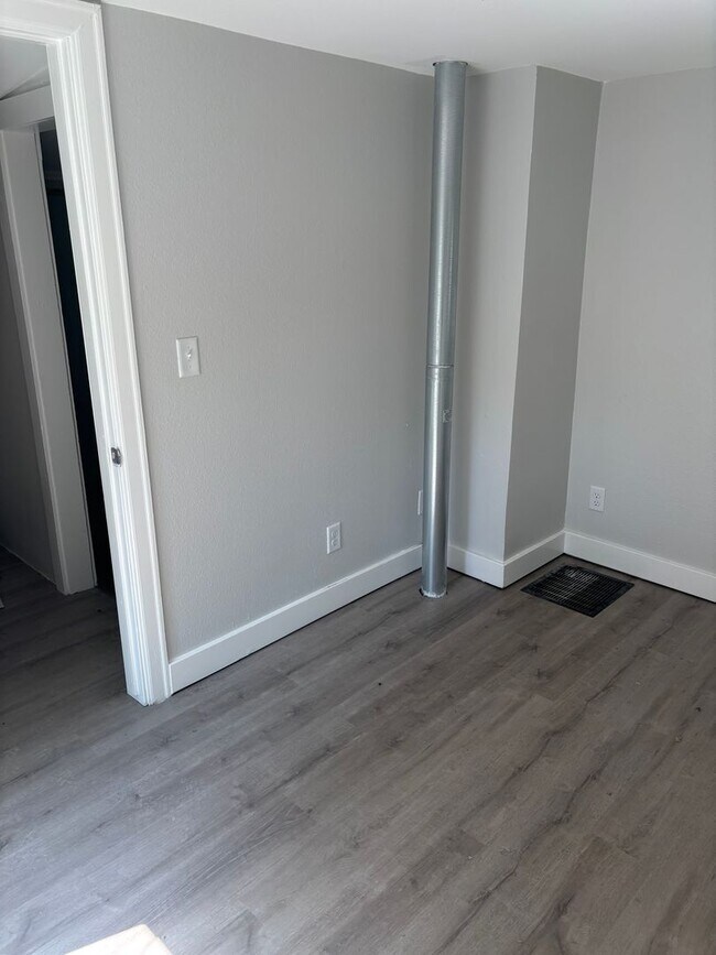 Building Photo - Perfect Home for You and Your Pup! Dog House Included + Fenced Yard