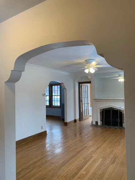 Living room view into sunroom and dining room - 4 S Spooner St