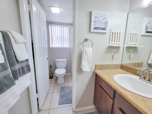 The bathroom includes a separate space for shower/ toilet. - 3500 N Hayden Rd