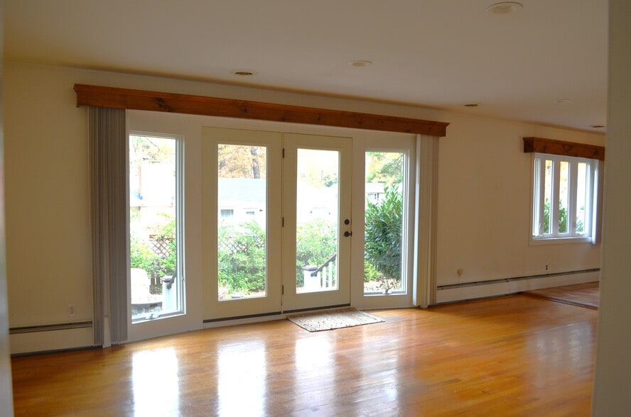 Family room looking out to backyard and stone patio - 45 Emerson Rd