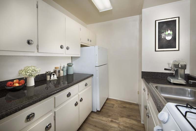 Galley-style kitchen at Flower Branch Apartments in Silver Spring, MD - Flower Branch Apartments