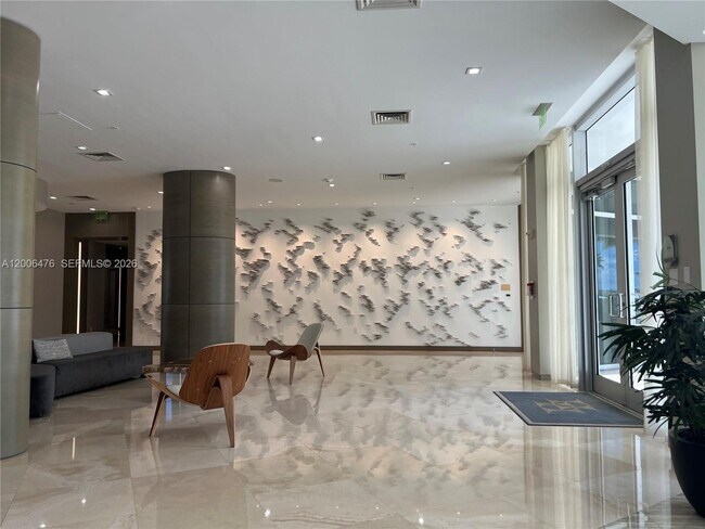 Building Photo - 10275 Collins Ave