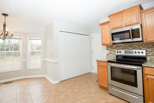 Building Photo - "Charming 4-Bedroom Home with Granite Coun...