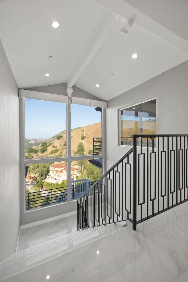 Building Photo - Modern Elegance Meets Scenic Privacy in Be...