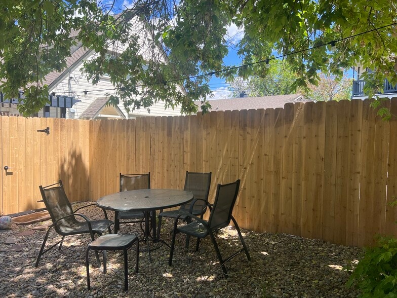 Spacious backyard with multiple areas for seating. - 920 University Ave