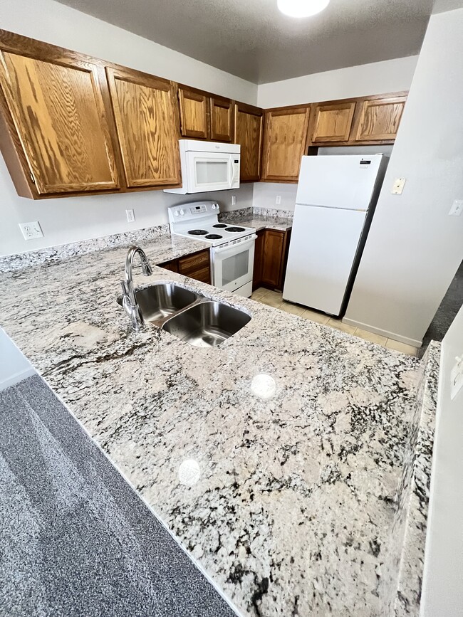 beautiful brand new granite countertops throughout - 4616 E 12th St