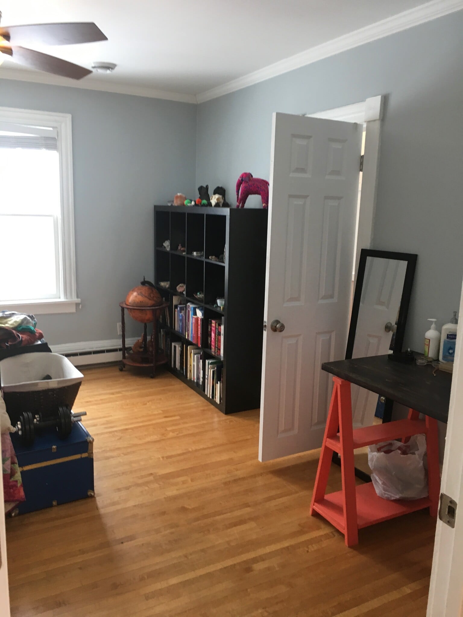 The front bedroom with hardwood floors and doorway to walk in closet. - 1320 Jefferson St NE