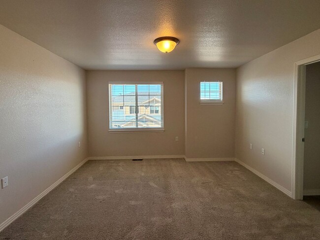 Building Photo - Move-In Ready 3-Story Townhome with Loft & 2-Car Garage