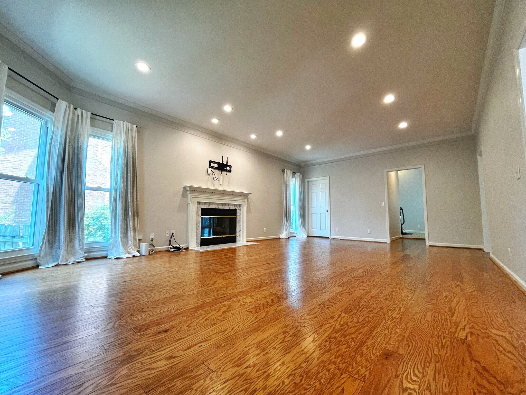 Large living room with plenty of natural light - includes gas fireplace. Home is AT&T Fiber ready. - 604 Sherbourne Grn
