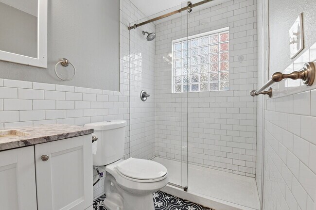 Building Photo - $3,045.95, 3 bed, 2 bath house in Denver with Fenced in Yard and In Unit Laundry!