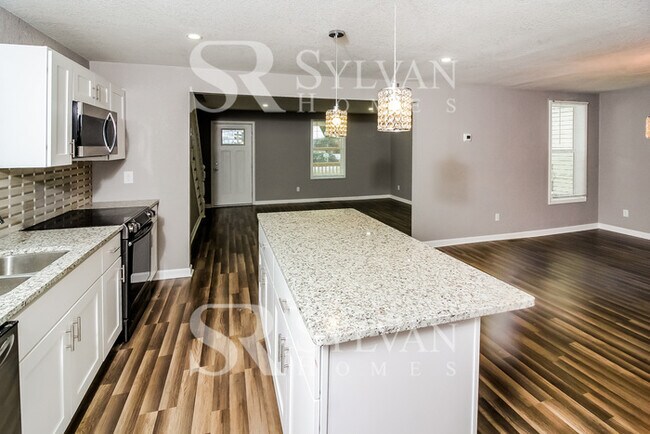 Building Photo - Turn the key. Enter. Smile. Repeat every day!