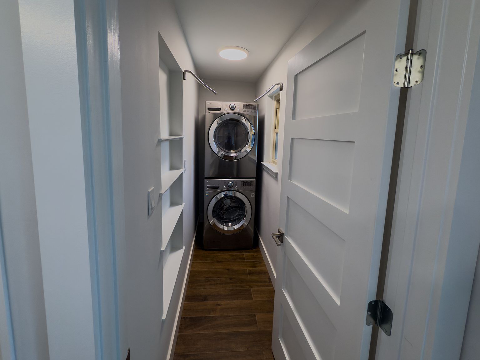 Laundry area with built-in shelving and storage - 2006 Candle Ct