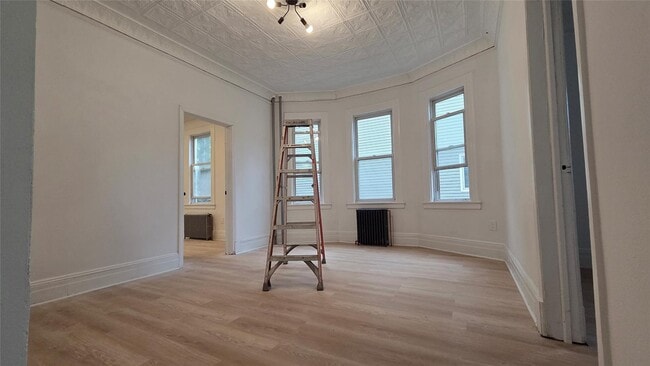 Building Photo - 42-21 65th Pl