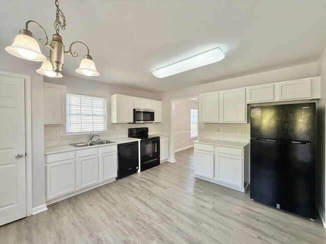 Building Photo - Updated 4BD, 2.5BA Raleigh Home With Easy ...