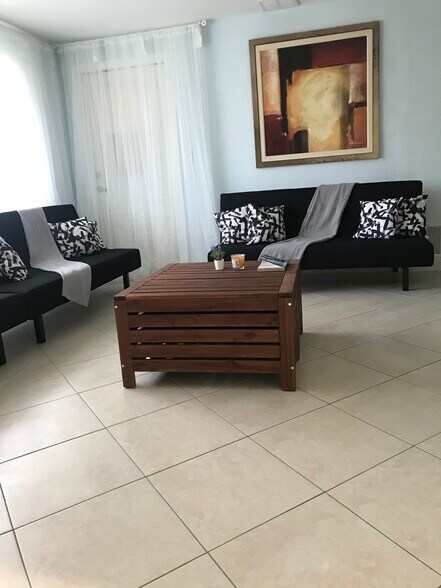 living room with 65' tv - 2440 Manasota Beach Rd