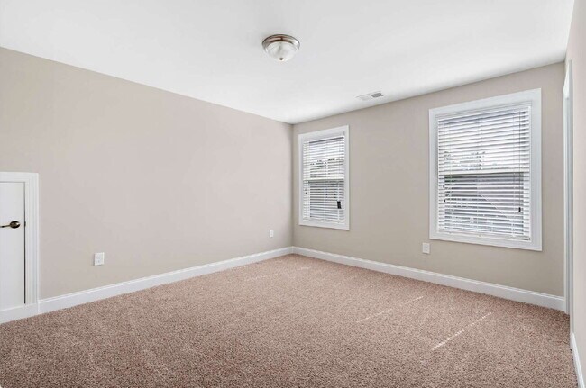 Building Photo - Luxurious 4-Bedroom Retreat with Third Floor Bonus Room & Fenced-in Backyard