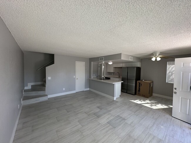 Building Photo - Cozy 2 bd, 1.5 bath condo with open floor plan.
