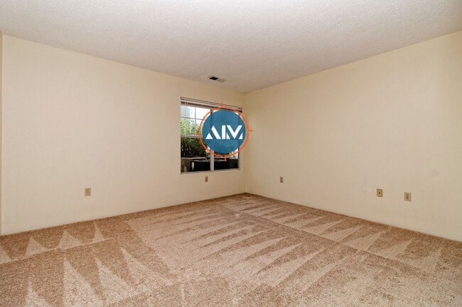 Building Photo - Charming First-Floor Condo with Pond Views at The Estate at Westbury